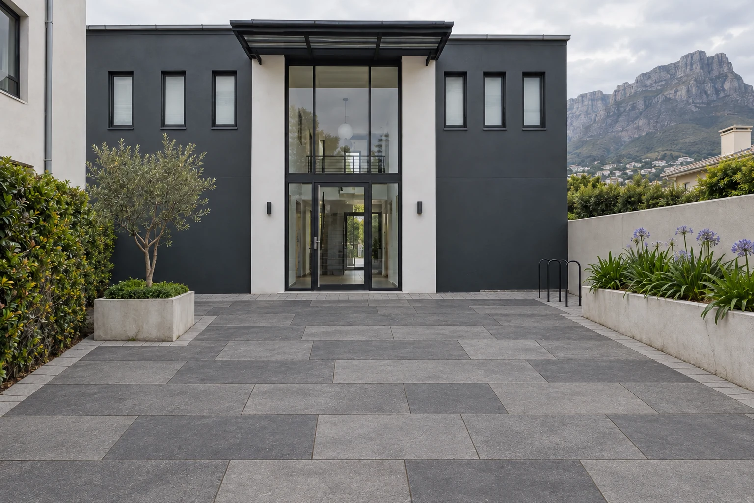 Generated after view of the same apartment entrance with grey slab paving