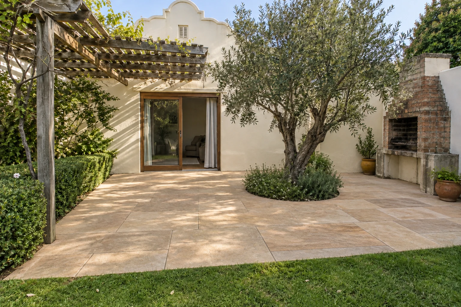 Generated after view of the same rear terrace with warm sandstone-coloured paving