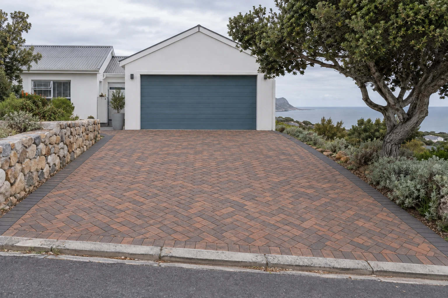 Generated view of the same fictional coastal driveway paved in warm clay brick